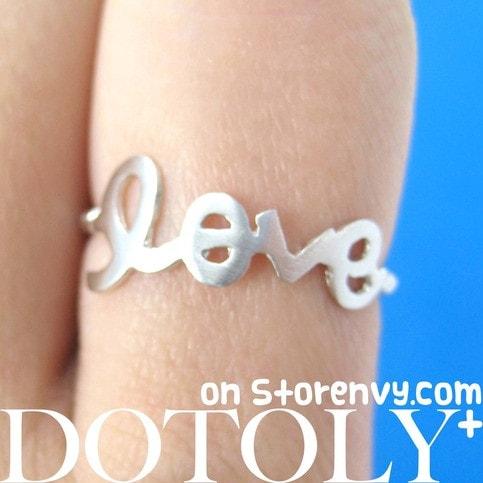 Ring that says on sale love in cursive