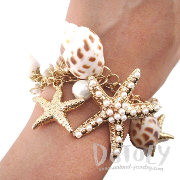 Marine-style metal bracelet with corals, starfish and shells – Bysimon  Group S.r.l.