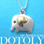 small-elephant-animal-charm-necklace-in-silver-with-gold-heart-detail