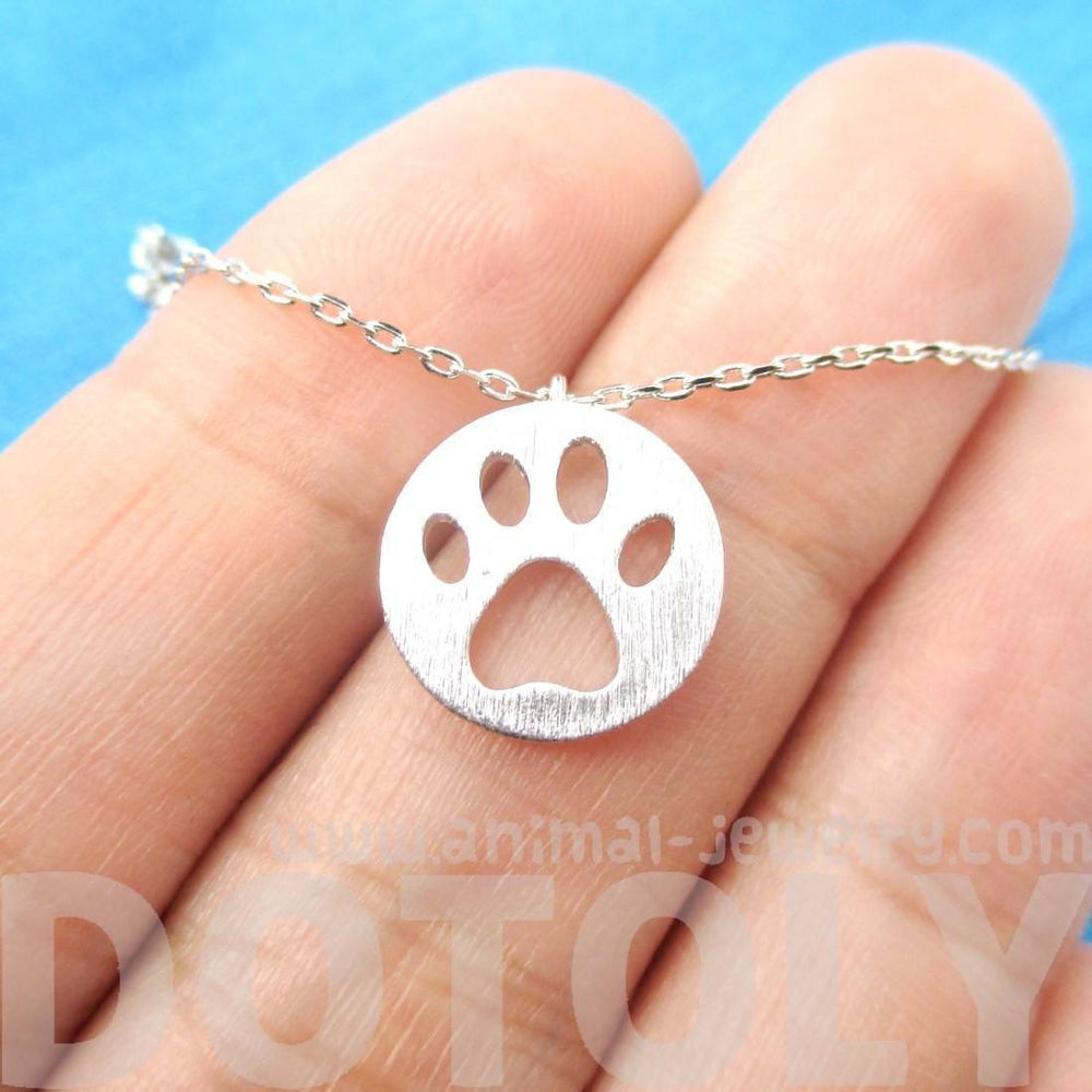 Round Puppy Paw Print Cut Out Shaped Pendant Necklace in Silver | Animal Jewelry | DOTOLY